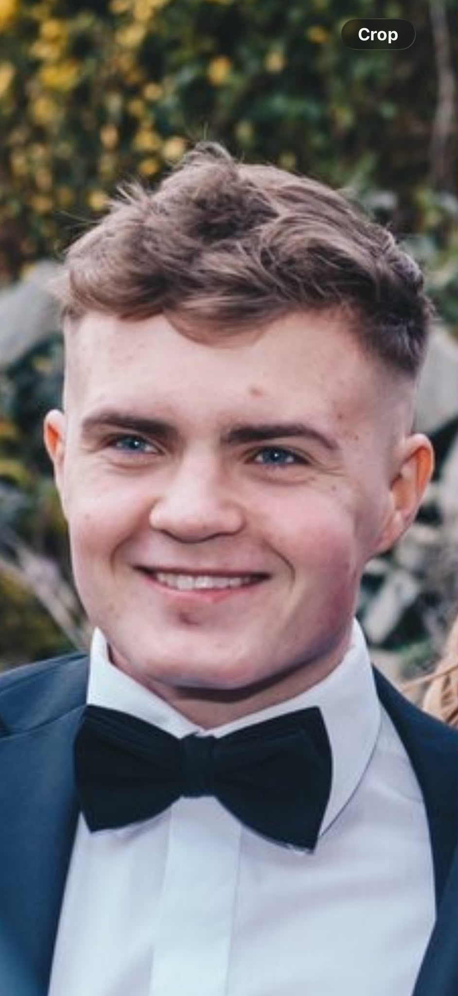 Luke smiling in a portrait
